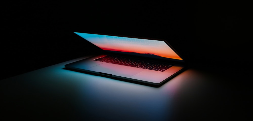 A fraud analyst reviewing transaction data on multiple monitors