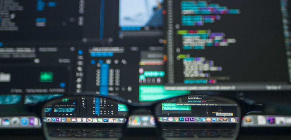 Engineer working on infrastructure code with multiple terminal windows